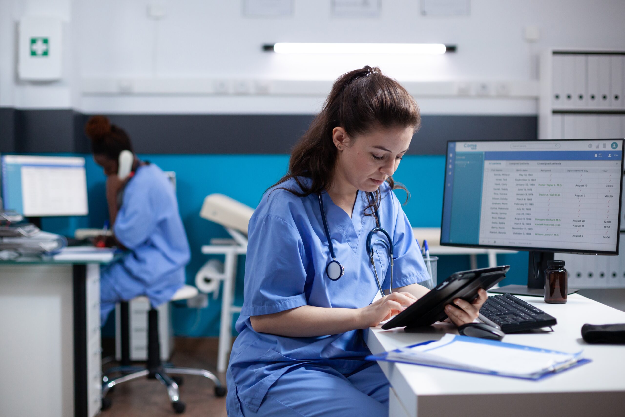 Nurse working at a computer workstation