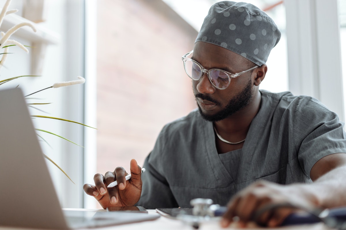 Primary care provider and oncologist reviewing a patient&rsquo;s care