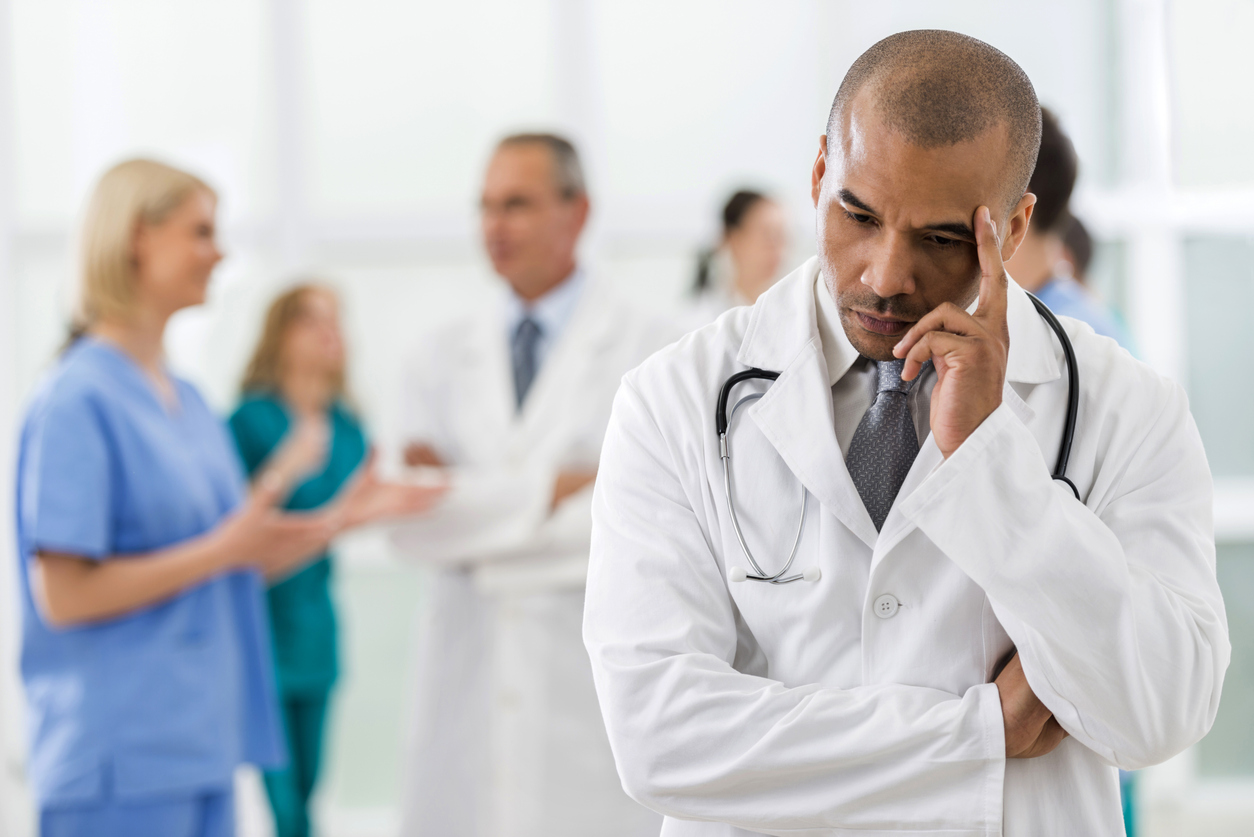 Physician walking through a hospital hallway